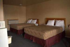 Postel nebo postele na pokoji v ubytování Juniper Motel Madras