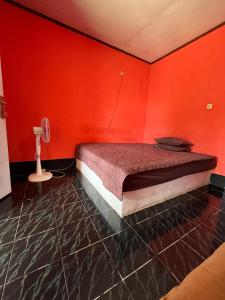 Perwita Homestay客房内的一张或多张床位