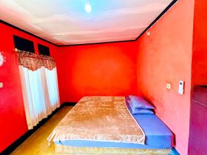 Perwita Homestay客房内的一张或多张床位