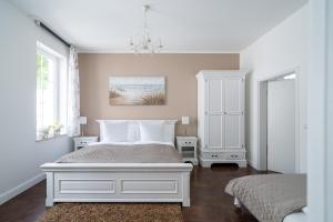 Postel nebo postele na pokoji v ubytování Villa Meeresgold - Stilvolle Auszeit nur 150 Meter vom Strand
