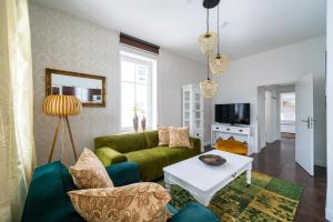 TV a/nebo společenská místnost v ubytování Villa Meeresgold - Stilvolle Auszeit nur 150 Meter vom Strand