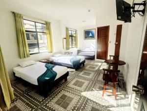 Postel nebo postele na pokoji v ubytování Hostal Gardner + 31 fotografií