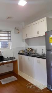 Kuchyň nebo kuchyňský kout v ubytování Sanjang Apartments + 1 fotografie