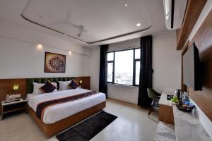 Giường trong phòng chung tại Soil to Soul Trinity Hotel - A Boutique Stay