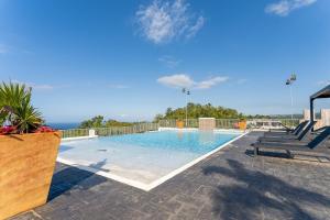 a swimming pool on top of a house at Great Escape Villa - Ocho Rios in Ocho Rios