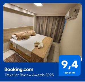 a hotel room with a bed with towels on it at Tambaú Israel Flat 217 - Beira mar in João Pessoa