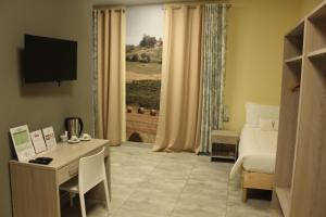 TV a/nebo společenská místnost v ubytování Volpedo hostel