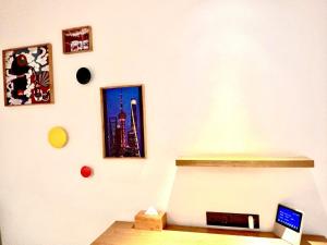 a corner of a room with a wall with a laptop at Campanile Shanghai Huaihai in Shanghai