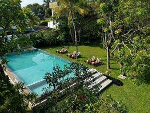 Bazén v ubytování Paradise Garden Beruwala nebo v jeho okolí