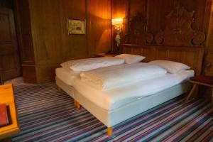 Postel nebo postele na pokoji v ubytování Hotel Schrenkhof