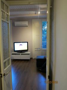 A television and/or entertainment centre at Apartment Sant Francesc