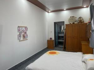 Postel nebo postele na pokoji v ubytování Khôi Homestay