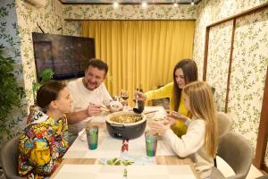 a group of people sitting around a table eating food at Numazu Sparkle in Numazu