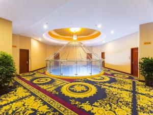 a large lobby with a large room with a large glass dome at Junlai Hotel Pudong Airport Shanghai in Shanghai
