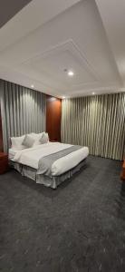 Postel nebo postele na pokoji v ubytování  Al Jawhara Park + 35 fotografií