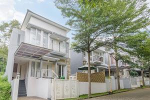 a house with a solar panel on the front of it at Calma Edelweiss Villa Lawang Malang in Malang