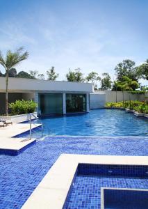 a swimming pool in front of a house at Samba Rio Convention & Residence in Rio de Janeiro