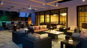 a restaurant with couches and tables and a bar at Hilton Orange County/Costa Mesa in Costa Mesa