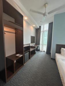 Ein Bett oder Betten in einem Zimmer der Unterkunft Scott Hotel KL Sentral