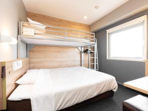 Postel nebo postele na pokoji v ubytování Super Hotel Gotemba Nigo-Kan