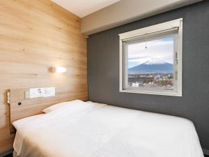 Postel nebo postele na pokoji v ubytování Super Hotel Gotemba Nigo-Kan