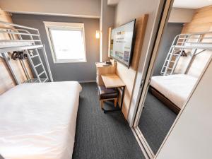 Postel nebo postele na pokoji v ubytování Super Hotel Gotemba Nigo-Kan