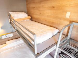 Postel nebo postele na pokoji v ubytování Super Hotel Gotemba Nigo-Kan