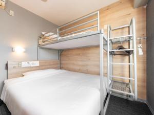 Postel nebo postele na pokoji v ubytování Super Hotel Gotemba Nigo-Kan