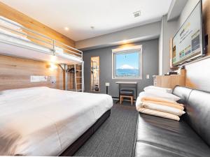 Postel nebo postele na pokoji v ubytování Super Hotel Gotemba Nigo-Kan