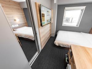 Postel nebo postele na pokoji v ubytování Super Hotel Gotemba Nigo-Kan