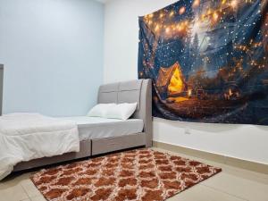 a bedroom with a bed and a painting on the wall at Leisure Home - 7pax Camping Theme in Kampong Lobok +14 photos