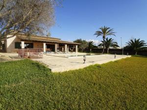 a building with three fire hydrants in a park at Finca Na Boneta in Santanyi