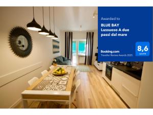 A television and/or entertainment centre at BLUE BAY Lussuoso A due passi dal mare
