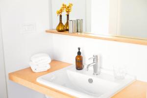 a bathroom with a sink and a mirror at Milnamour, Whole House by the Sea with Parking in Hvar +36 photos