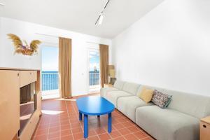 a living room with a couch and a table at Milnamour, Whole House by the Sea with Parking in Hvar