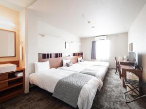 Ένα ή περισσότερα κρεβάτια σε δωμάτιο στο Vessel Hotel Fukuoka Kaizuka +94 φωτογραφίες