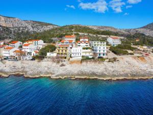 an aerial view of a group of houses on a rocky beach at Milnamour, Whole House by the Sea with Parking in Hvar