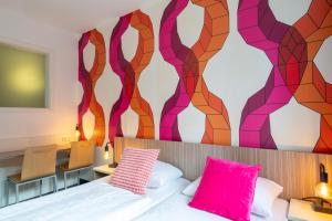 Letto o letti in una camera di Hotel Madeleine Biohotel