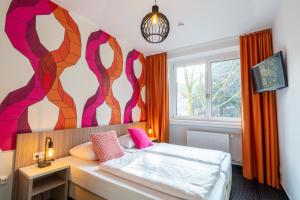 Letto o letti in una camera di Hotel Madeleine Biohotel
