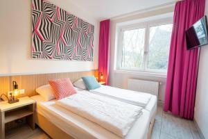 Letto o letti in una camera di Hotel Madeleine Biohotel