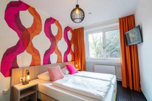 Letto o letti in una camera di Hotel Madeleine Biohotel