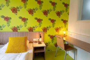 Letto o letti in una camera di Hotel Madeleine Biohotel