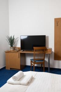 TV a/nebo společenská místnost v ubytování Hotel Apollon + 28 fotografií