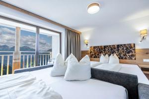 Postelja oz. postelje v sobi nastanitve Berggasthof Hochzeigerhaus