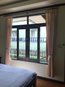 Ein Bett oder Betten in einem Zimmer der Unterkunft บ้านต้นรักษ์ BanTonRuk Takuapa