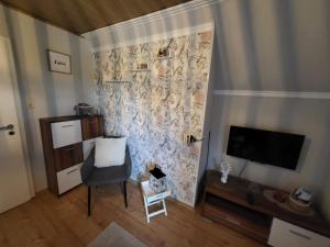 TV a/nebo společenská místnost v ubytování Ferienwohnung Naturblick