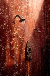 a shower with water coming out of it at Chamhouse - Long Thủy - Phú Yên in Long Thủy