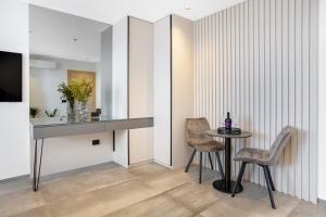 a dining room with a table and two chairs at Fly Room - S5 - MPolo in Medulin
