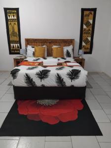 Postel nebo postele na pokoji v ubytování Sunshinevibe guest house