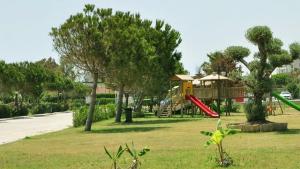 a park with a playground with a slide at Hotel Dionisus Spa Resort in Belek